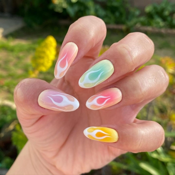 Aries is a fire sign that's known for its fearless yet playful nature. So you'll want bold and firey elements in an Aries nail look. Here are 20 options to inspire you.