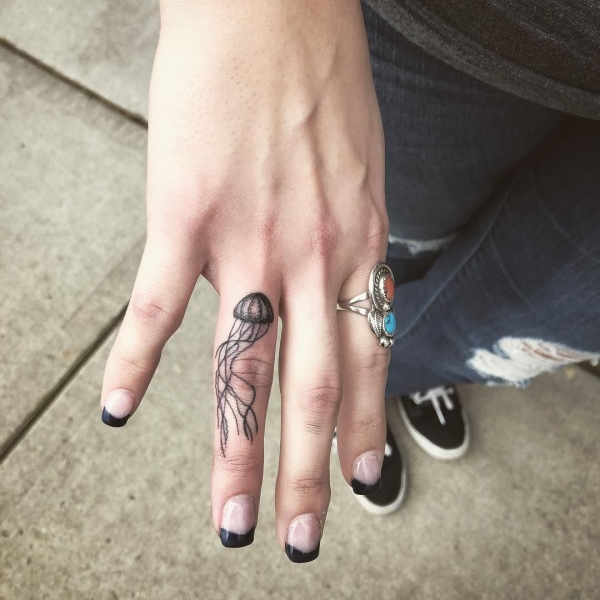 Tiny tattoos are trending in a major way, allowing fans to adorn themselves in a collage of delicate designs—or just one teeny tiny design. Scroll through these 25 tiny tattoos for inspiration.