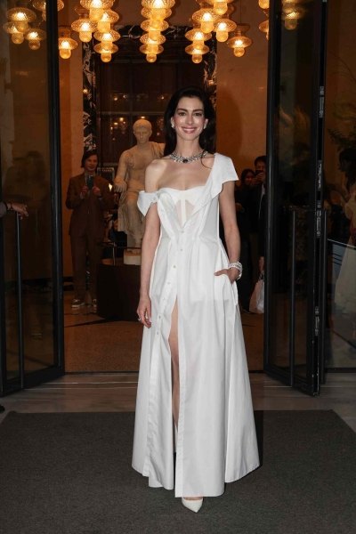 Anne Hathaway attended a Bulgari event in Rome in a Gap button-up dress layered over a sheer corset, turning the casual staple into a formal gown. See the fully unexpected look from every angle here.