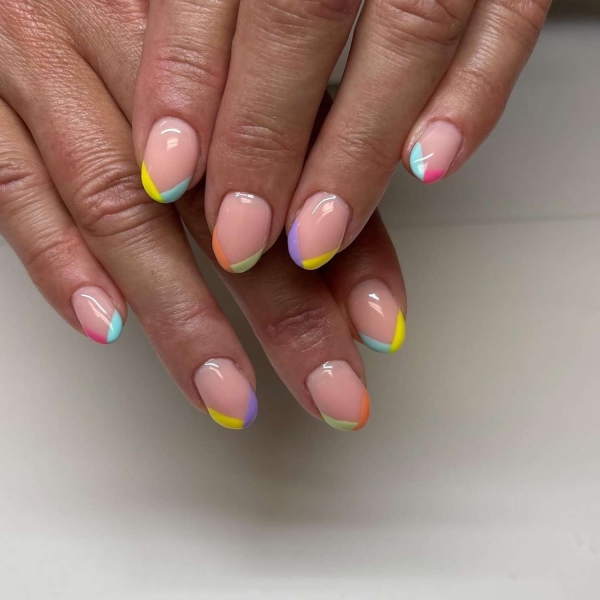 Short nails just make more sense for summer. From graphic designs to cool embellishments, find over a dozen short summer nail ideas for the months ahead here.