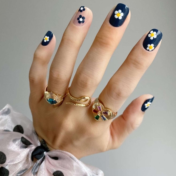 Short nails just make more sense for summer. From graphic designs to cool embellishments, find over a dozen short summer nail ideas for the months ahead here.