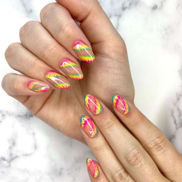 Short nails just make more sense for summer. From graphic designs to cool embellishments, find over a dozen short summer nail ideas for the months ahead here.