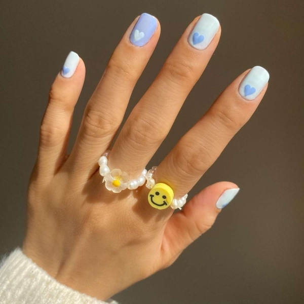 Short nails just make more sense for summer. From graphic designs to cool embellishments, find over a dozen short summer nail ideas for the months ahead here.