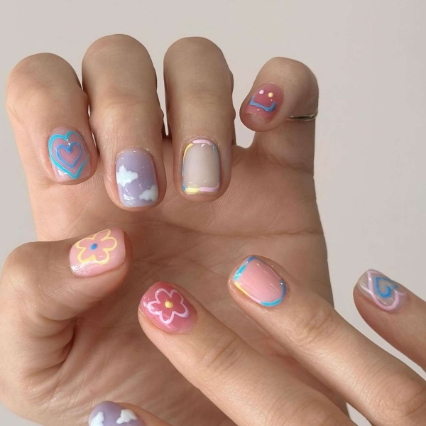 Short nails just make more sense for summer. From graphic designs to cool embellishments, find over a dozen short summer nail ideas for the months ahead here.