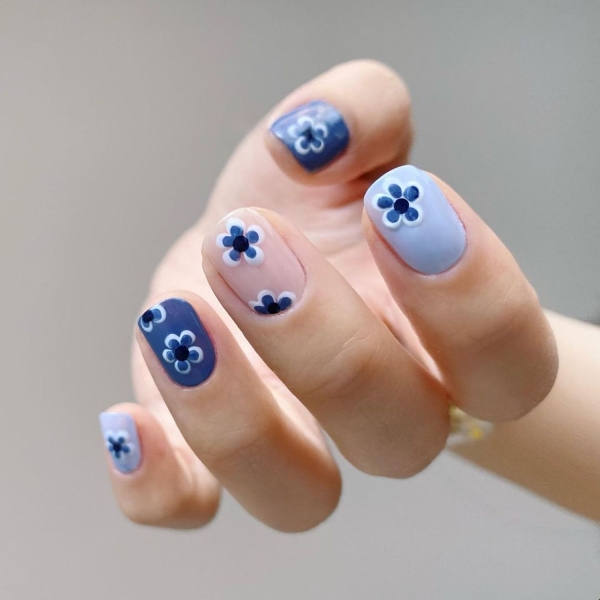 Short nails just make more sense for summer. From graphic designs to cool embellishments, find over a dozen short summer nail ideas for the months ahead here.