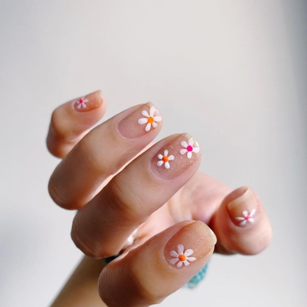 Short nails just make more sense for summer. From graphic designs to cool embellishments, find over a dozen short summer nail ideas for the months ahead here.