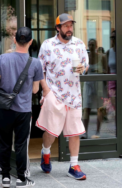 Emily Ratajkowski wore basketball shorts and a boxy white T-shirt. See her full look, reminiscent of Adam Sandler's signature style, here.