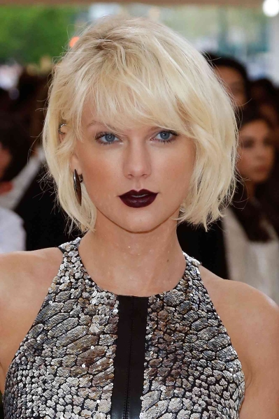 From bangs to bobs, Taylor Swift's signature blonde locks have had dozens of iterations across many trends and eras. See her hair’s lengthy evolution, via 15 of her most iconic mane moments.