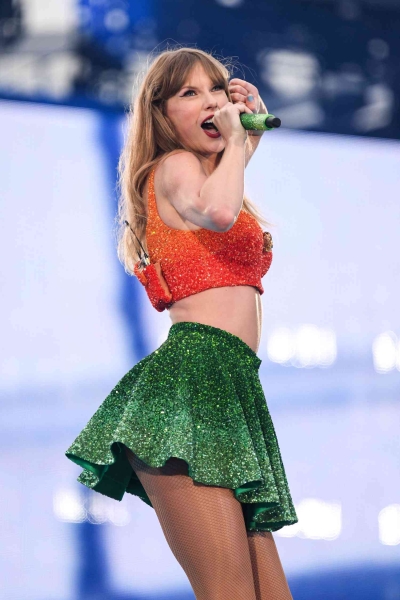 Taylor Swift kicked off her Eras Tour in Ireland with a sparkly green-and-orange two-piece set on Friday (June 29). See her look from every angle here.