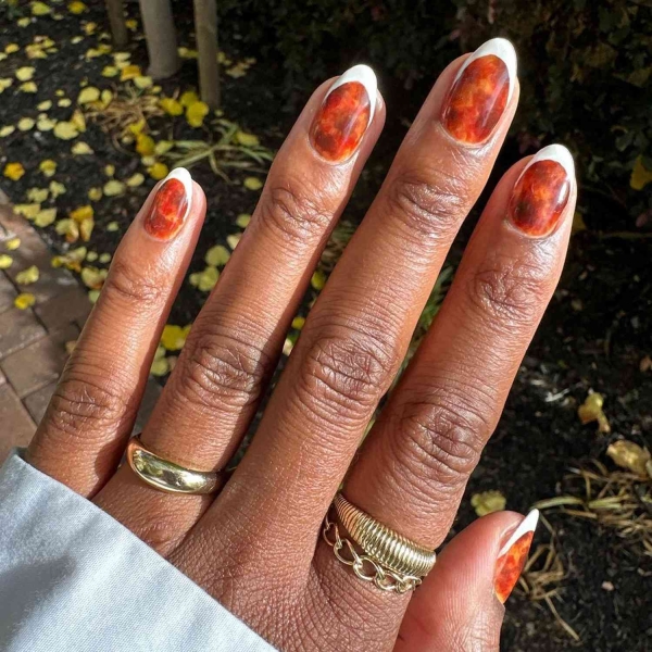 While classic pink and white French manis are making a comeback, brown French tip nails offer an updated take on the classic look. Here, find a dozen brown french tip nail looks for inspiration.