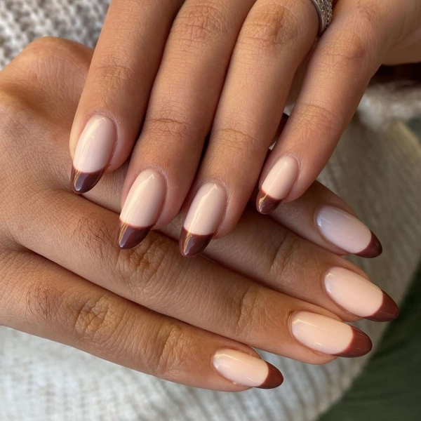 While classic pink and white French manis are making a comeback, brown French tip nails offer an updated take on the classic look. Here, find a dozen brown french tip nail looks for inspiration.