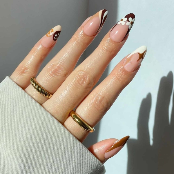 While classic pink and white French manis are making a comeback, brown French tip nails offer an updated take on the classic look. Here, find a dozen brown french tip nail looks for inspiration.