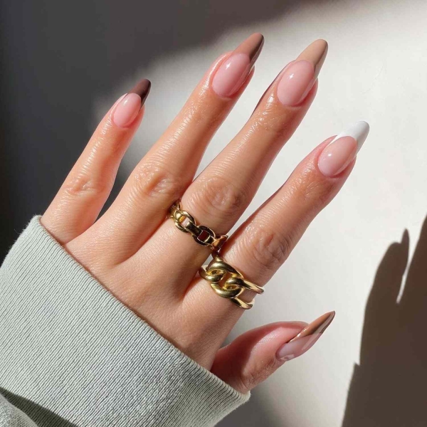 While classic pink and white French manis are making a comeback, brown French tip nails offer an updated take on the classic look. Here, find a dozen brown french tip nail looks for inspiration.