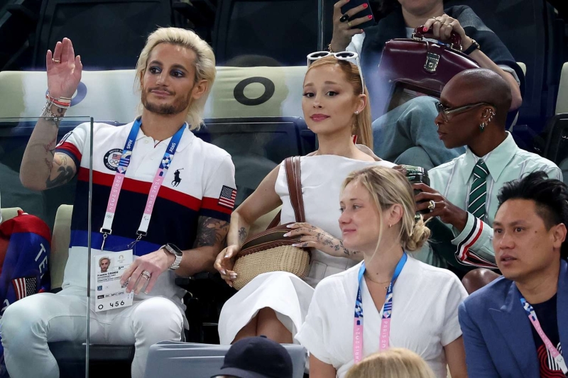 Ariana Grande attended the women's artistic gymnastic qualifiers on Sunday in an outfit that embraced Audrey Hepburn's '60s style. See her full look, here.