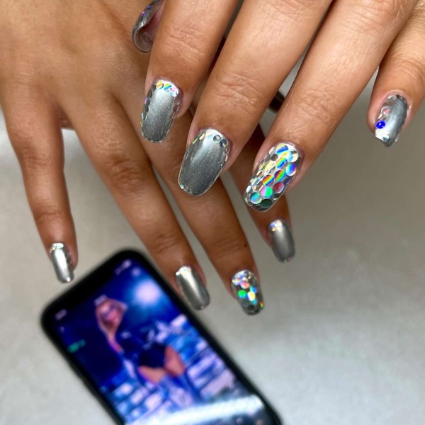 Birthdays are a time for celebration, making color and creativity par for the course. Here, explore over a dozen fun birthday nail ideas that fit the bill.