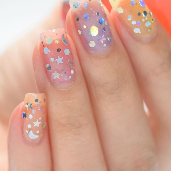 Birthdays are a time for celebration, making color and creativity par for the course. Here, explore over a dozen fun birthday nail ideas that fit the bill.