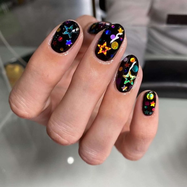 Birthdays are a time for celebration, making color and creativity par for the course. Here, explore over a dozen fun birthday nail ideas that fit the bill.