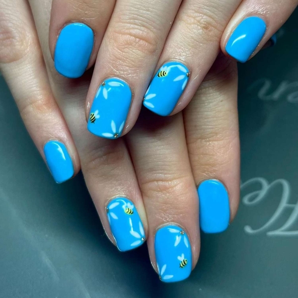 Blue nail designs are popular year-round for their fresh and cool vibe. Here, discover 20 blue nail designs to recreate at home with tips from pro nail artists.