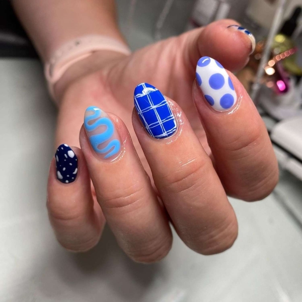 Blue nail designs are popular year-round for their fresh and cool vibe. Here, discover 20 blue nail designs to recreate at home with tips from pro nail artists.