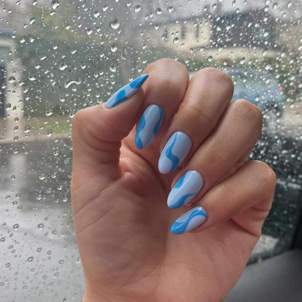 Blue nail designs are popular year-round for their fresh and cool vibe. Here, discover 20 blue nail designs to recreate at home with tips from pro nail artists.