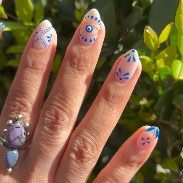 Blue nail designs are popular year-round for their fresh and cool vibe. Here, discover 20 blue nail designs to recreate at home with tips from pro nail artists.