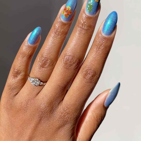 Blue nail designs are popular year-round for their fresh and cool vibe. Here, discover 20 blue nail designs to recreate at home with tips from pro nail artists.