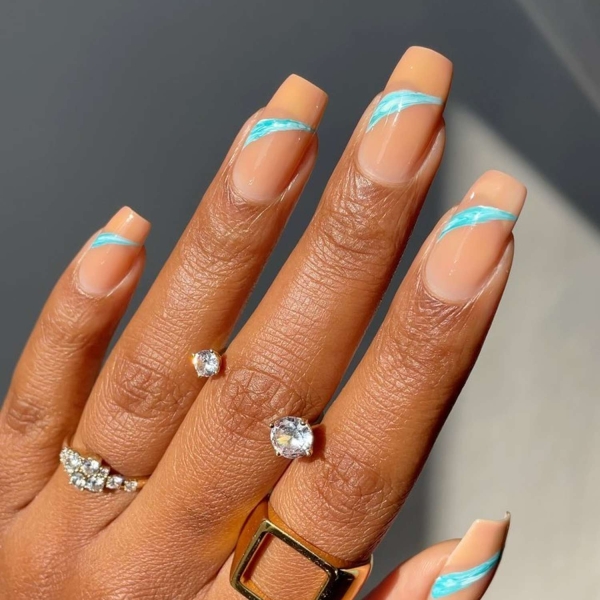 Blue nail designs are popular year-round for their fresh and cool vibe. Here, discover 20 blue nail designs to recreate at home with tips from pro nail artists.