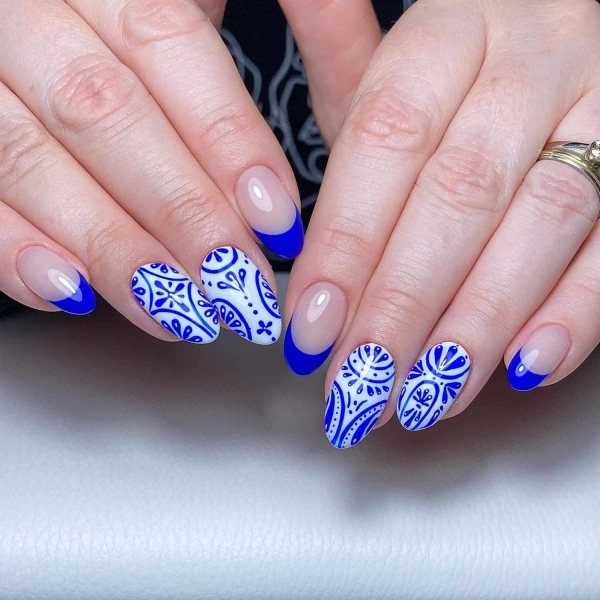 Blue nail designs are popular year-round for their fresh and cool vibe. Here, discover 20 blue nail designs to recreate at home with tips from pro nail artists.