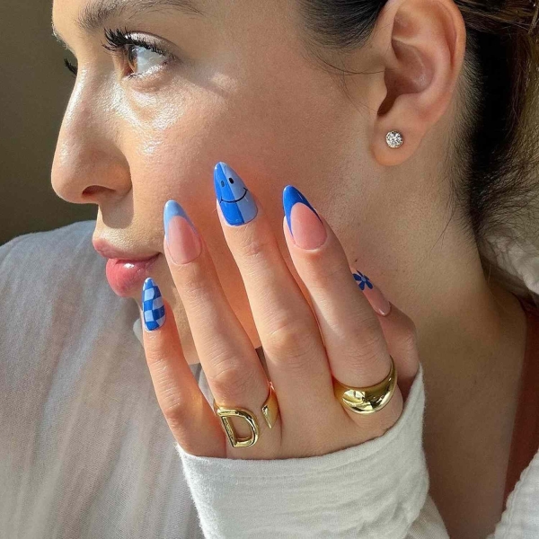 Blue nail designs are popular year-round for their fresh and cool vibe. Here, discover 20 blue nail designs to recreate at home with tips from pro nail artists.