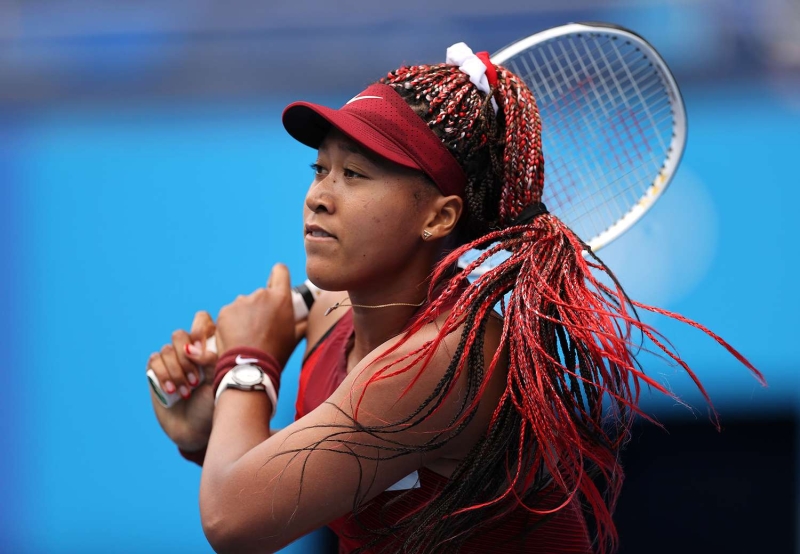 In a sea of uniforms, many Olympic athletes tap into beauty to express their personality and sense of style. From Florence Griffith-Joyner's nails to Naomi Osaka's bright red braids, here are our favorite Olympic beauty looks of all time.