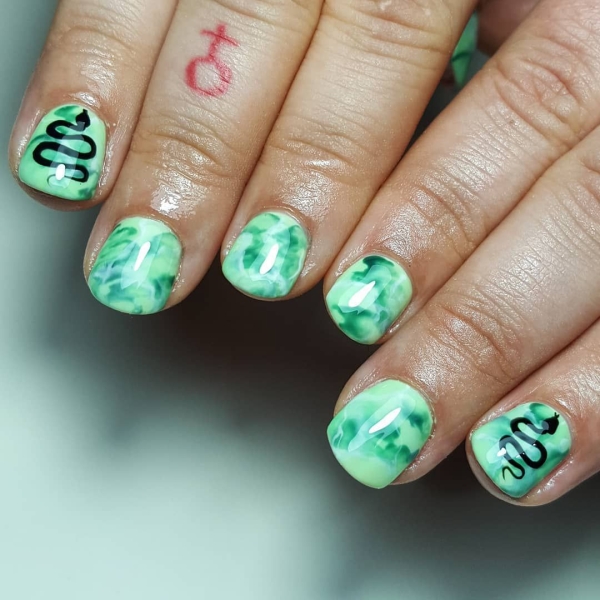 It's undeniable: Green is the color of the moment. Whether you want to go full neon or more muted, here are 18 short green nail looks to inspire your next manicure.