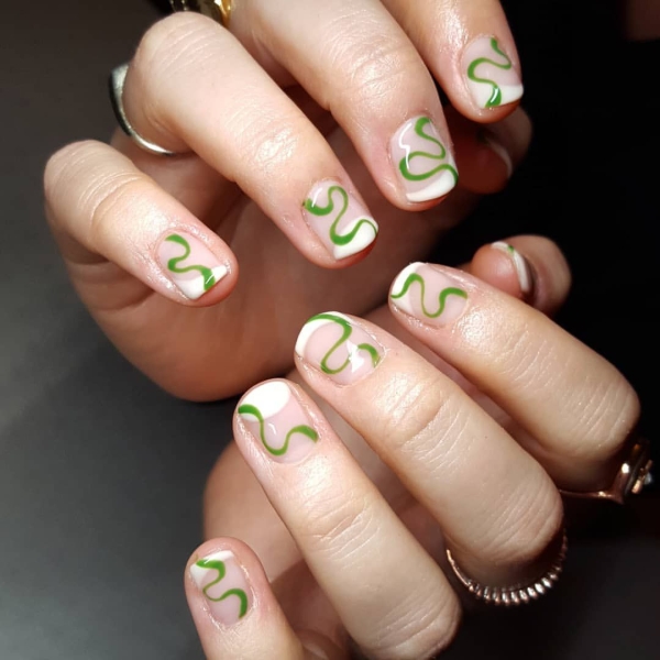 It's undeniable: Green is the color of the moment. Whether you want to go full neon or more muted, here are 18 short green nail looks to inspire your next manicure.