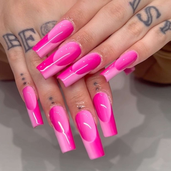 Pink ombre nails are trending for summer 2024. Here, explore our favorite pink ombre nail designs.