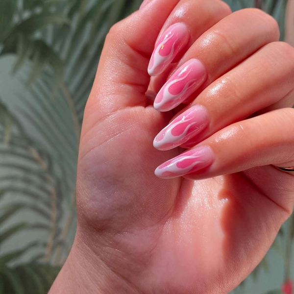 Pink ombre nails are trending for summer 2024. Here, explore our favorite pink ombre nail designs.