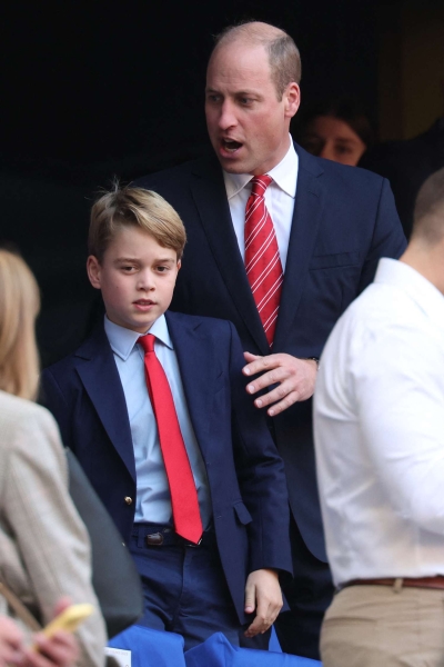 Prince George reportedly "insists on dressing" like his dad, Prince William. Their twinning outfits have given way to some adorable moments. See them, here.