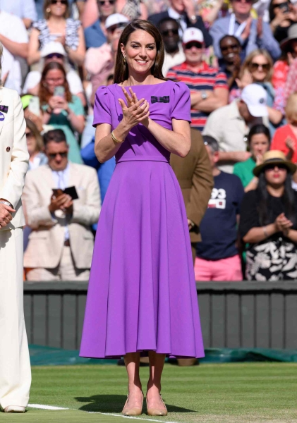 Royal insiders explained all the special Easter eggs and significant messages in Kate Middleton's purple Safiyaa dress at Wimbledon.