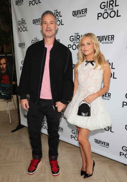 Sarah Michelle Gellar supported her husband, Freddie Prinze Jr., at the premiere of his new movie 'The Girl in the Pool' while wearing a sheer white lace minidress.