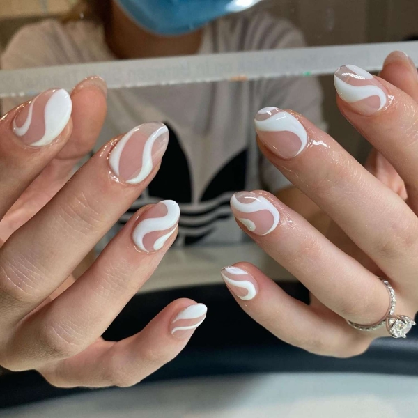 Simple white nail designs never go out of style. Here, explore some of our favorite simple white nail designs, plus get tips from manicurists on how to recreate them.