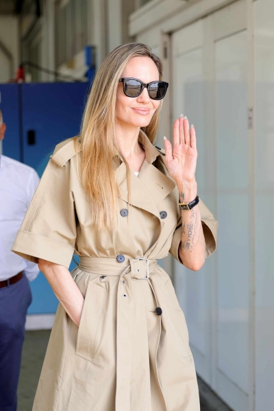 Angelina Jolie wore a short-sleeved trench coat in Venice. See the summertime twist she gave her go-to outerwear, here.