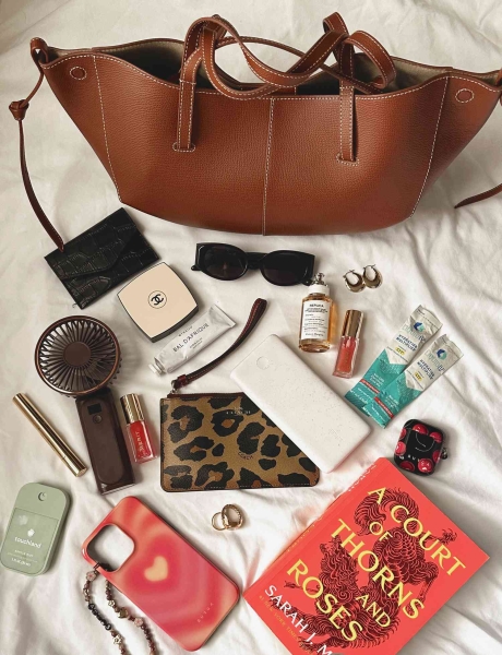 I rounded up 10 of my handbag essentials that I refuse to leave the house without, including Dezi sunglasses, a Chanel compact, Touchland hand sanitizer, Byredo hand lotion, Apple AirPods, and more.