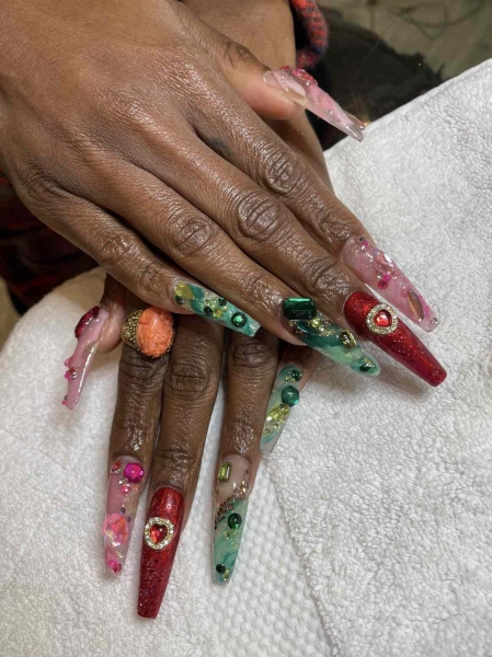 Take a page out of Cynthia Erivo's book and don a "Wicked"-themed manicure, adorned with loads of sparkle, texture, and creativity.