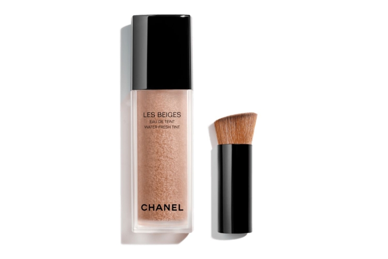 The five makeup products an editor is bringing on their summer vacation for glowy skin, including Chanel Les Beiges Water-Fresh Skin Tint, Saie Dew Blush, Tarte Creaseless Creamy Concealer, and more.