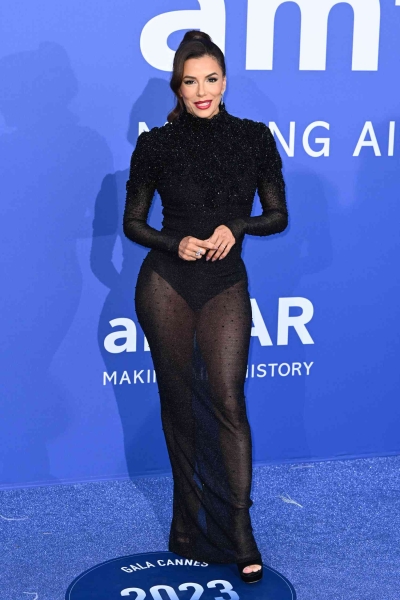 Eva Longoria made an appearance at the annual amfAR Gala at Venice Film Festival wearing a a black sequined gown that was sheer from the waist down. See her full look, here.