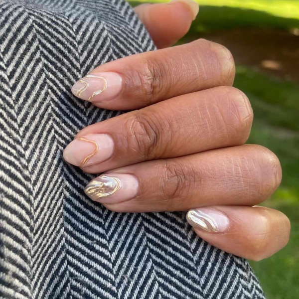 From graphic patterns to jewelry-like embellishments, here are 60 of the most stunning manicures for fall.