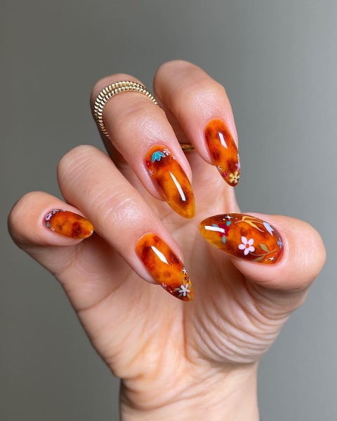 From graphic patterns to jewelry-like embellishments, here are 60 of the most stunning manicures for fall.