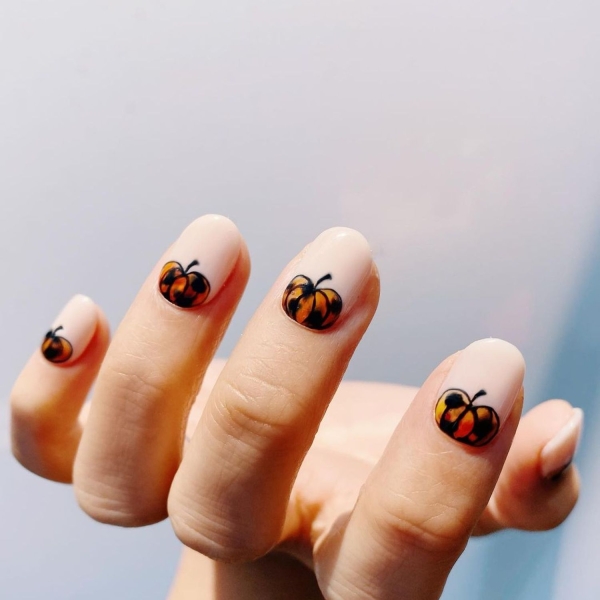 Pumpkin spice season has transcended the world of coffee to inspire fashion and beauty statements alike. Here, explore a bevy of pumpkin spice nail ideas for the most perfect fall mani.