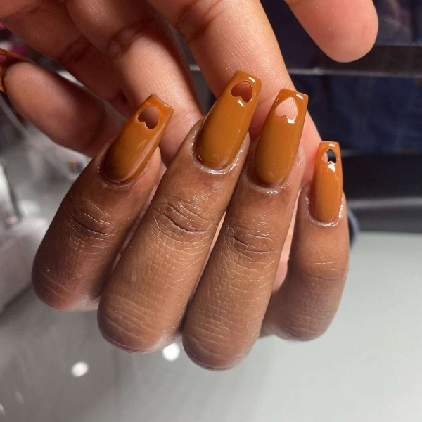 Pumpkin spice season has transcended the world of coffee to inspire fashion and beauty statements alike. Here, explore a bevy of pumpkin spice nail ideas for the most perfect fall mani.