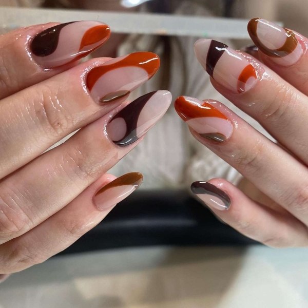 Pumpkin spice season has transcended the world of coffee to inspire fashion and beauty statements alike. Here, explore a bevy of pumpkin spice nail ideas for the most perfect fall mani.