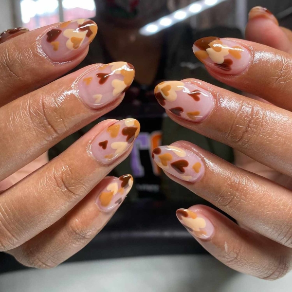 Pumpkin spice season has transcended the world of coffee to inspire fashion and beauty statements alike. Here, explore a bevy of pumpkin spice nail ideas for the most perfect fall mani.