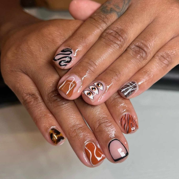 Pumpkin spice season has transcended the world of coffee to inspire fashion and beauty statements alike. Here, explore a bevy of pumpkin spice nail ideas for the most perfect fall mani.